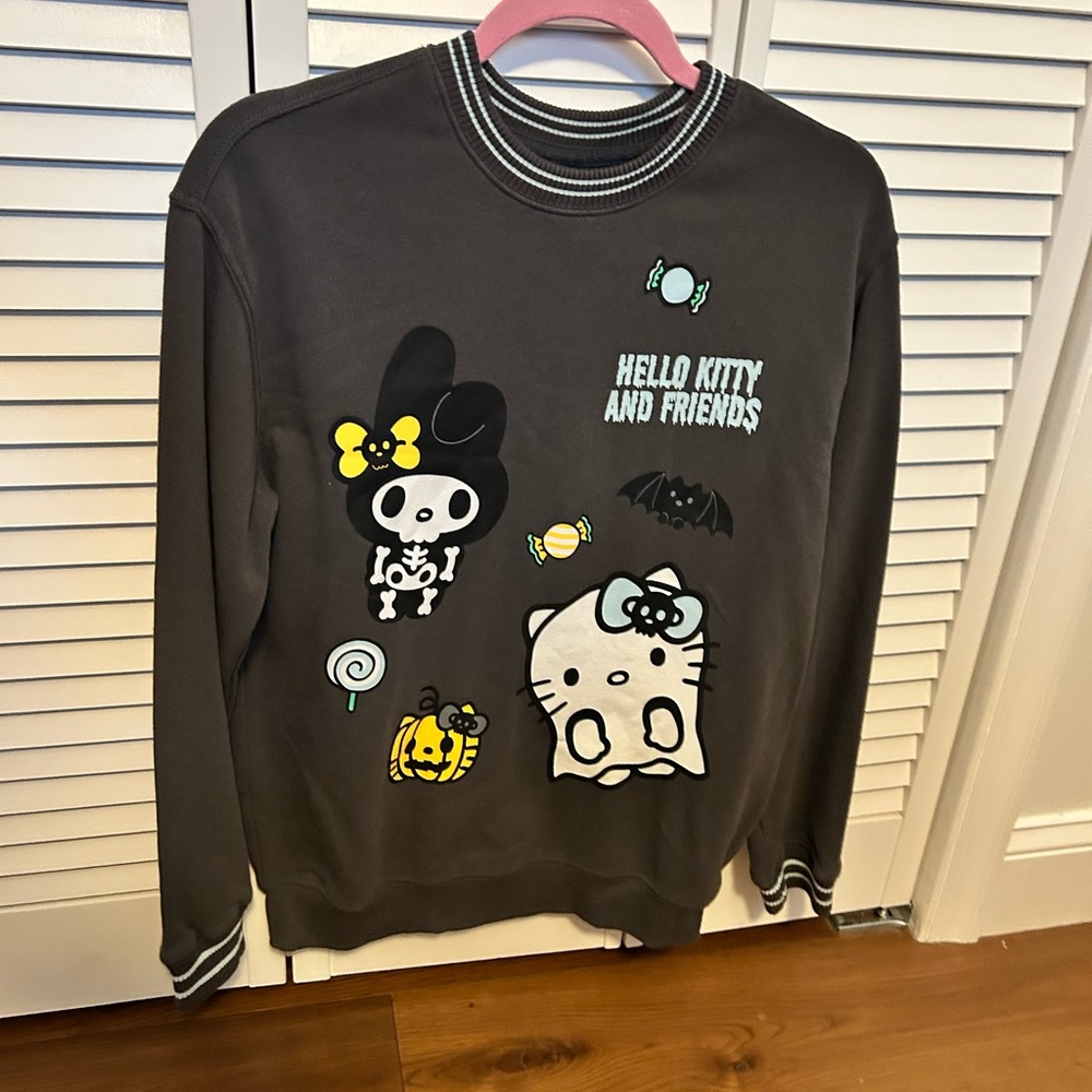 Hello Kitty and Friends Halloween Graphic Sweatshirt- graphic on front and back.